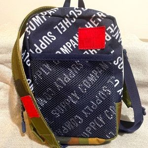 Herschel Supply Co. Pop Quiz Crossbody Roll Call Peacoat/Woodland Camo